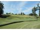 Lush green golf course with well-maintained greens and picturesque homes in the background at 3835 Greenside Ct, Dacula, GA 30019