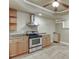 View of kitchen with stainless steel appliances, cabinets, and tile floor at 3835 Greenside Ct, Dacula, GA 30019