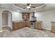 Open kitchen features stainless steel appliances, tile floor, cabinets and sink at 3835 Greenside Ct, Dacula, GA 30019