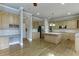 Spacious kitchen with an island, stainless appliances, light wood cabinets, and hardwood floors at 3835 Greenside Ct, Dacula, GA 30019