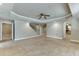Living room with tiled floors, stairway, arched entryway, and neutral color palette at 3835 Greenside Ct, Dacula, GA 30019