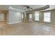 Bright living room with tile flooring, ceiling fan, and natural light at 3835 Greenside Ct, Dacula, GA 30019