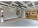 Open floor plan featuring a living room that flows into a kitchen area and a staircase leading to the upper level at 3835 Greenside Ct, Dacula, GA 30019