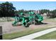 A bright green playground with slides and climbing structures, offering a fun and safe environment for to play and explore at 3835 Greenside Ct, Dacula, GA 30019