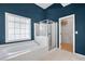 Elegant bathroom features a soaking tub, glass-enclosed shower, and a doorway to a walk-in closet at 5466 Vinings Lake Way, Mableton, GA 30126