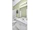 Bright bathroom with a shower/tub combo, single sink vanity, neutral wall color, and a decorative painting at 5466 Vinings Lake Way, Mableton, GA 30126
