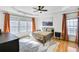 Cozy bedroom with a ceiling fan, warm decor, hardwood floors, and ample natural light at 5466 Vinings Lake Way, Mableton, GA 30126