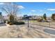 View of the community entrance with well-manicured landscaping and visible signage on a bright, sunny day at 5466 Vinings Lake Way, Mableton, GA 30126