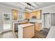 Charming kitchen with stainless appliances, ample countertops and center island at 5466 Vinings Lake Way, Mableton, GA 30126