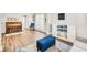Open-concept living room with an area rug, wood flooring, and cozy furniture at 5466 Vinings Lake Way, Mableton, GA 30126