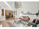 Bright living room features a balcony, natural light, and hardwood floors at 5466 Vinings Lake Way, Mableton, GA 30126