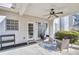 Relaxing covered patio with outdoor seating, a ceiling fan, and views of the backyard at 5466 Vinings Lake Way, Mableton, GA 30126