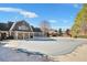 Large covered community pool with outdoor seating area, and well-maintained landscaping on a sunny day at 5466 Vinings Lake Way, Mableton, GA 30126