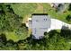 Well maintained home showing the roof with lush surrounding landscape and trees at 2116 Strasburg Ct, Dunwoody, GA 30338