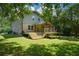 Lush backyard with a newly installed deck and outdoor seating, ideal for entertaining or relaxing at 2116 Strasburg Ct, Dunwoody, GA 30338
