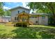 Expansive backyard featuring a wooden deck and a covered porch perfect for outdoor relaxation at 2116 Strasburg Ct, Dunwoody, GA 30338