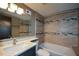 Updated bathroom featuring a shower over tub, modern tiling, vanity sink and updated fixtures at 2116 Strasburg Ct, Dunwoody, GA 30338
