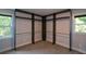 Walk-in closet with two windows and custom shelving, providing ample storage at 2116 Strasburg Ct, Dunwoody, GA 30338