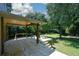 Expansive wooden deck with a covered area, offering a comfortable outdoor living space and stairs to the yard at 2116 Strasburg Ct, Dunwoody, GA 30338