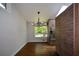 Dining area with hardwood floors, modern lighting, and a large window at 2116 Strasburg Ct, Dunwoody, GA 30338