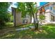 Attractive home exterior with brick accents, stone siding, a covered entry and mature landscaping at 2116 Strasburg Ct, Dunwoody, GA 30338