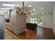 Open floor plan with living room and kitchen, featuring hardwood floors and modern appliances at 2116 Strasburg Ct, Dunwoody, GA 30338