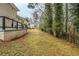 Backyard featuring lawn, landscape, an elevated deck and exterior access to the lush green space at 2916 Lloyd Rd, Decatur, GA 30034