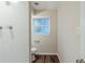 The bathroom features new hard-surface floors, a tiled shower and a bright window at 2916 Lloyd Rd, Decatur, GA 30034
