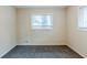 Neutral bedroom featuring plush carpeting and natural light from two windows at 2916 Lloyd Rd, Decatur, GA 30034