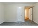 This bedroom offers plush carpeting, neutral paint and access to other rooms in the house at 2916 Lloyd Rd, Decatur, GA 30034