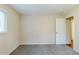 This bedroom offers a window, closet access and a neutral paint scheme at 2916 Lloyd Rd, Decatur, GA 30034