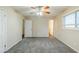 Bedroom with carpeted floors, a ceiling fan, and multiple doorways at 2916 Lloyd Rd, Decatur, GA 30034