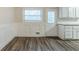 Charming dining area with hardwood floors, wainscoting, and natural light from the adjacent kitchen at 2916 Lloyd Rd, Decatur, GA 30034