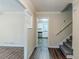 Inviting entryway showcasing hardwood floors and views into the modern kitchen with stainless steel appliances at 2916 Lloyd Rd, Decatur, GA 30034