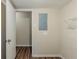 Laundry room with wood look floors, wire shelving, and utility connections at 2916 Lloyd Rd, Decatur, GA 30034