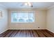 Bright living room with hardwood floors, neutral paint, and a large window offering natural light at 2916 Lloyd Rd, Decatur, GA 30034