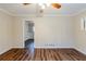 Spacious living room with hardwood floors, neutral paint, and a ceiling fan for added comfort at 2916 Lloyd Rd, Decatur, GA 30034