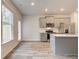 Stylish kitchen featuring modern appliances, quartz countertops, and access to the outdoor patio at 324 Shine Dr, Stockbridge, GA 30281