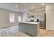 Modern kitchen featuring an island, stainless steel appliances, and ample cabinet space at 324 Shine Dr, Stockbridge, GA 30281