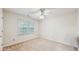 Neutral bedroom with clean carpet, large window with blinds, and ceiling fan at 3242 Inns Brook Way, Snellville, GA 30039
