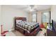 This spacious bedroom features a fan and a large bed with lots of storage drawers at 3242 Inns Brook Way, Snellville, GA 30039