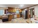 Spacious kitchen featuring stainless steel appliances, tile floors, and a breakfast bar at 3242 Inns Brook Way, Snellville, GA 30039