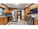 Well-lit kitchen with stainless steel appliances, ample cabinet space, and neutral tile flooring at 3242 Inns Brook Way, Snellville, GA 30039