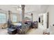 Spacious primary bedroom featuring a four poster bed, carpeted floors and a ceiling fan at 3242 Inns Brook Way, Snellville, GA 30039