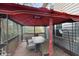 Inviting outdoor patio area featuring a covered gazebo with dining set and wooded views at 3242 Inns Brook Way, Snellville, GA 30039