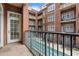 Balcony overlooking a beautiful courtyard pool in a classic brick building at 77 Peachtree Ne Pl # 402, Atlanta, GA 30309