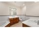 Elegant bathroom with a tub, toilet, and a double sink vanity at 77 Peachtree Ne Pl # 402, Atlanta, GA 30309