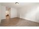 Spacious bedroom with hardwood floors and a view into the hall at 77 Peachtree Ne Pl # 402, Atlanta, GA 30309