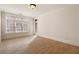 Sunlit bedroom showcasing hardwood flooring and a large window at 77 Peachtree Ne Pl # 402, Atlanta, GA 30309