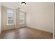 Bright bedroom features hardwood floors, crown molding, and large windows with natural light at 77 Peachtree Ne Pl # 402, Atlanta, GA 30309